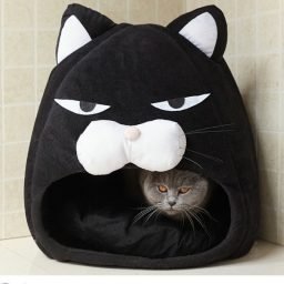 Black Cat Cave Bed with plush interior and a cat resting inside