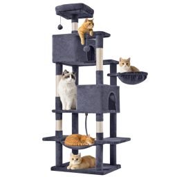 Five cats resting and playing on a tall multi-level 66-inch cat tree tower with condos, platforms, and scratching posts.